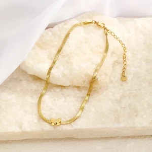 Enkelband plat vlinder goud