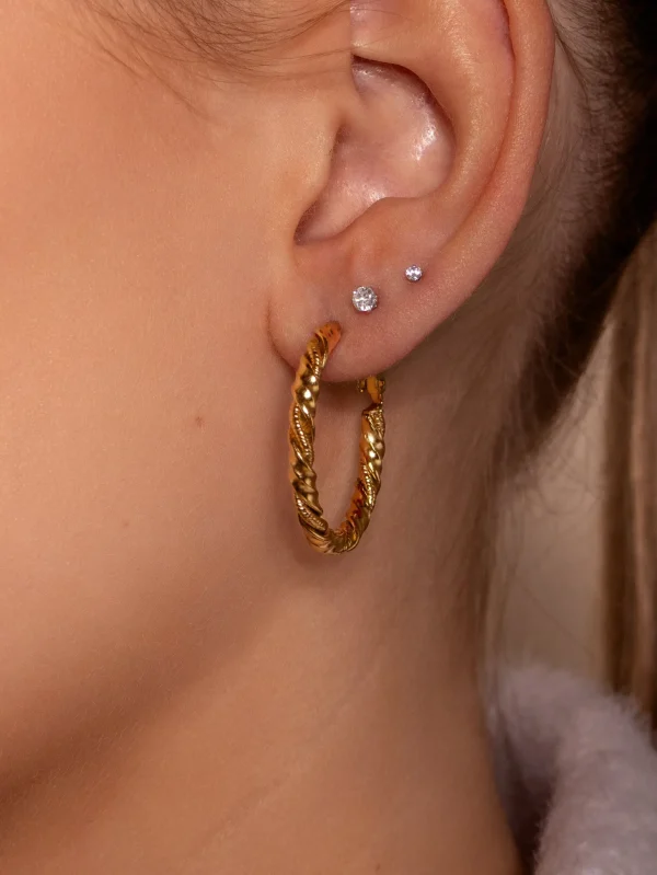 Hoops gedraaid motief goud