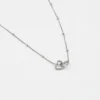 Ketting verbonden hartjes zilver