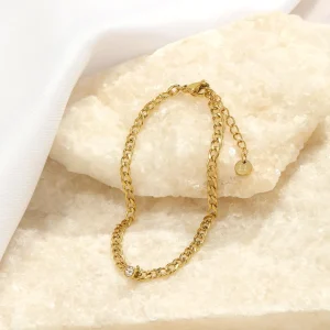 Schakelarmband steentje goud