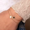 Single klaver armband goud/zwart